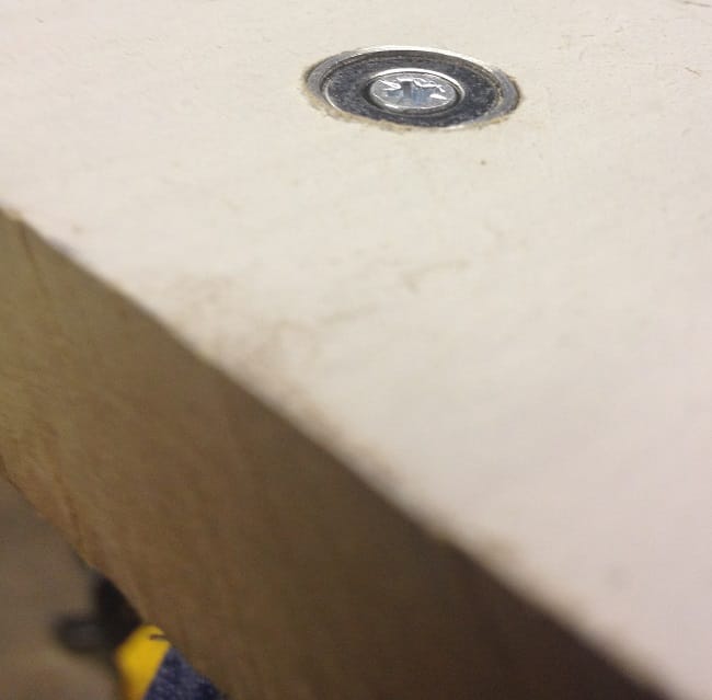 Countebored neodymium pot magnet rebated into MDF bath panel