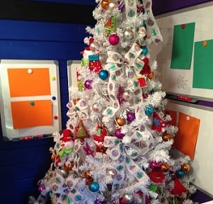 Magnetic noticeboards behind a decorated Christmas tree