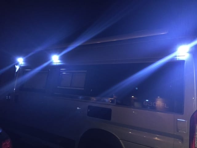 illuminated solar-powered lights on the outside of a motorhome