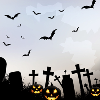 Halloween bats and pumpkins in graveyard