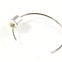 Half of a jewellery clasp on a memory wire ring.