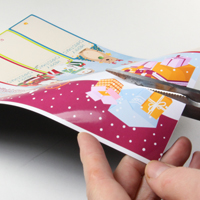 Cutting out bookmark designs from magnetic sheet