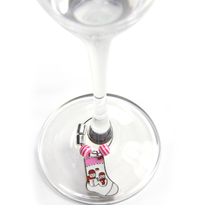 Wine glass with magnetic charm around the stem